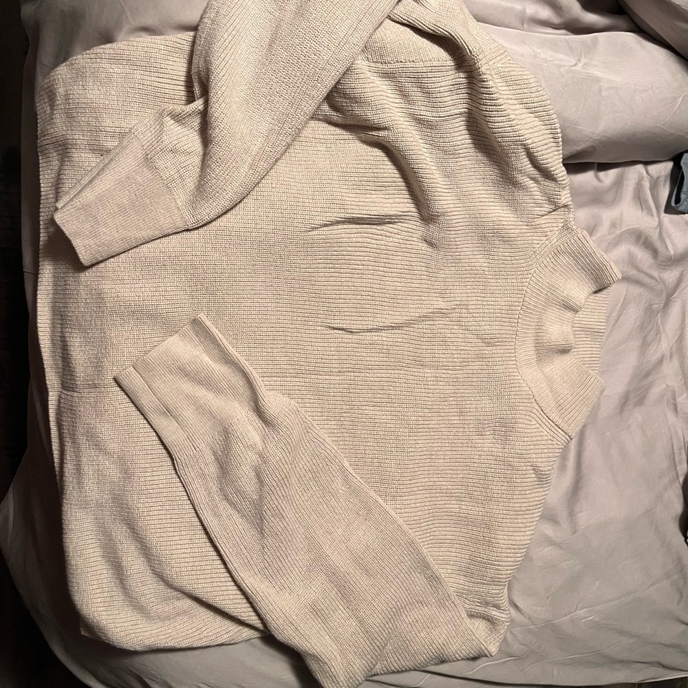 Merino Wool-Blend Ribbed
Turtleneck Sweater
